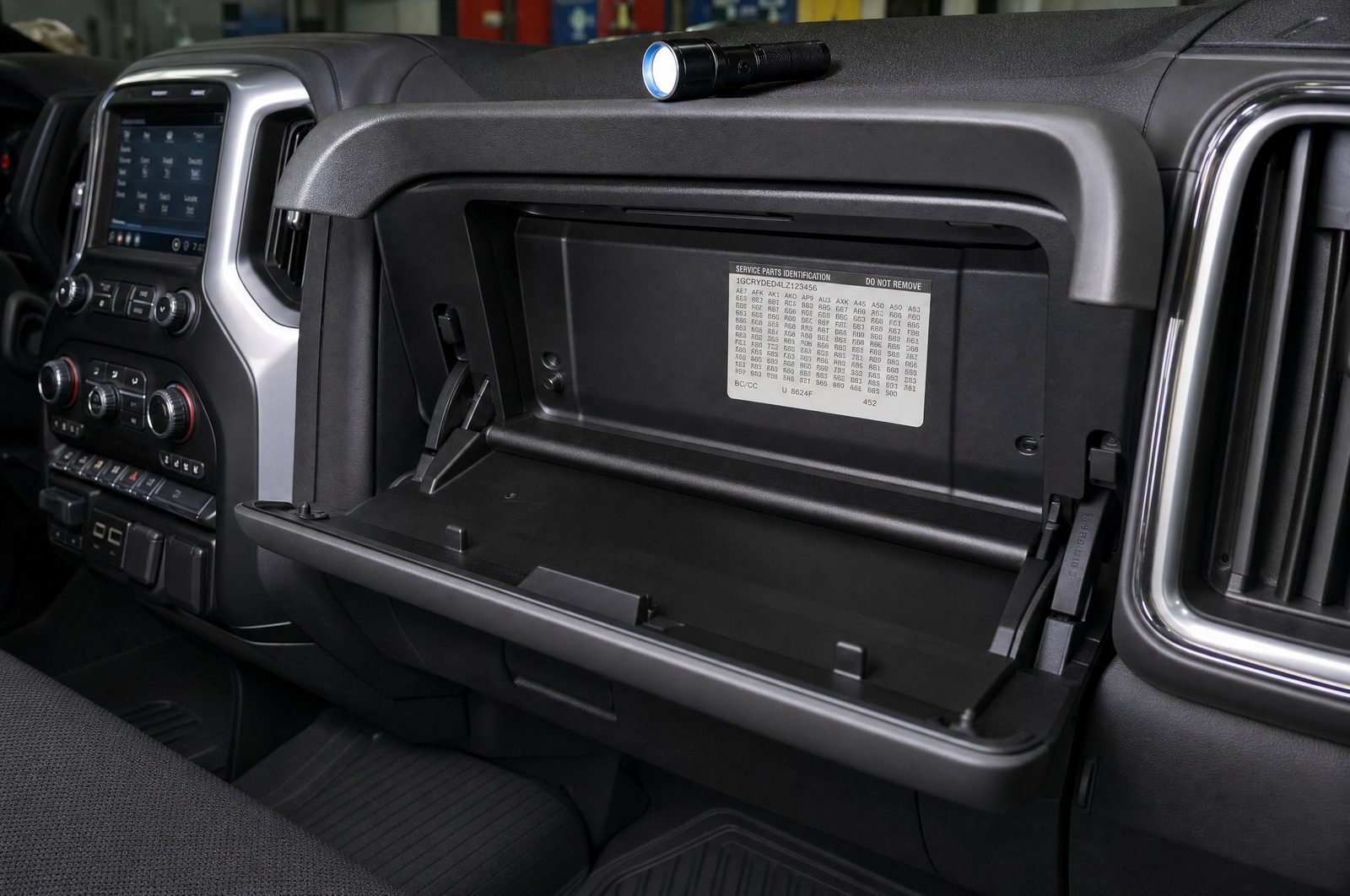 Paint code location inside the glovebox on the Service Parts Identification label of a GM truck